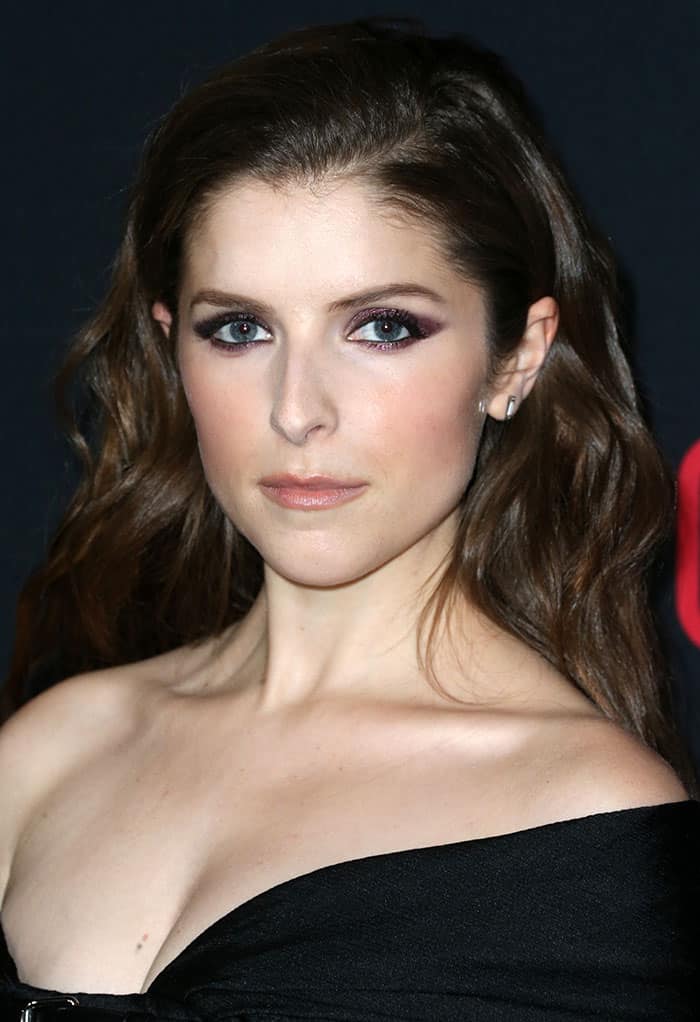 Anna Kendrick's hairstyle added a layer of grace; she let her glossy locks flow down in gentle waves