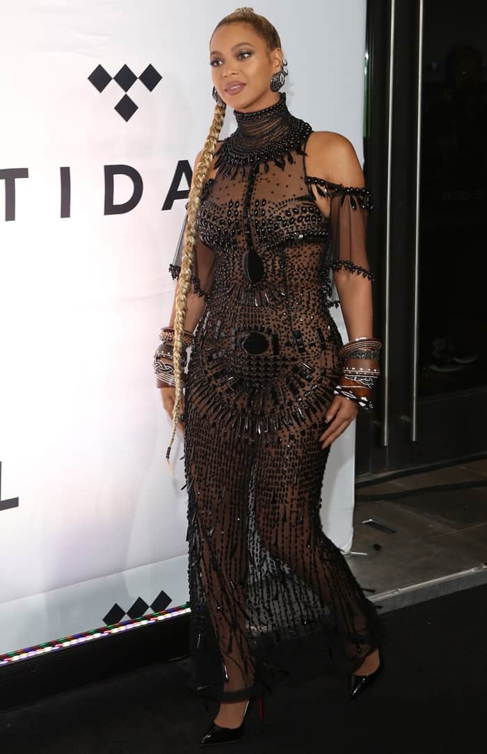Beyoncé stuns in a sheer, heavily-embellished Gattinoni Couture gown paired with Christian Louboutin 'So Kate' pumps at the Tidal X benefit concert in Brooklyn