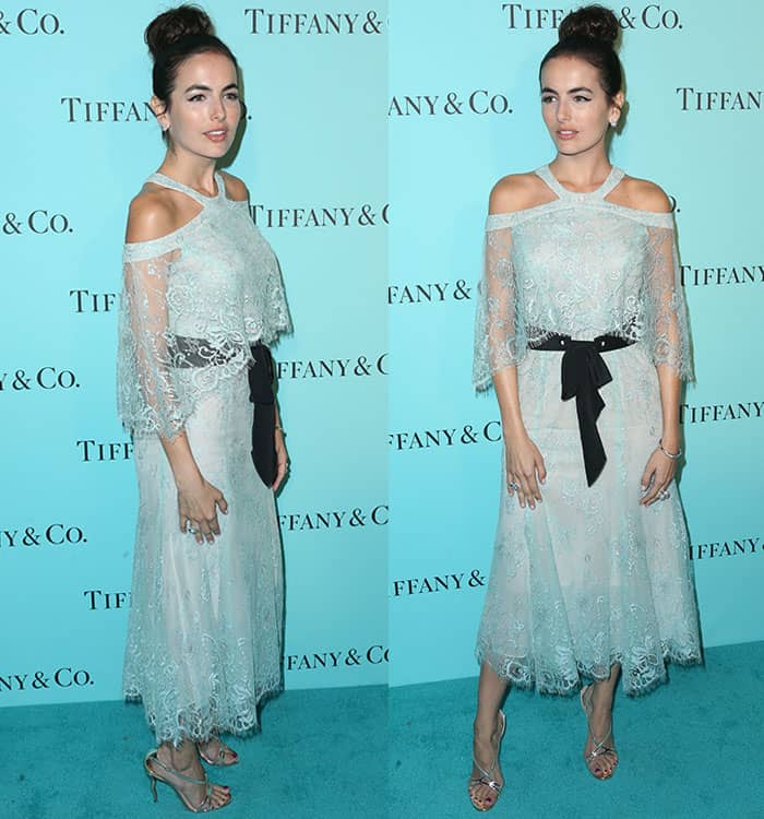 Camilla Belle's Monique Lhuillier dress features an off-the-shoulder bodice with Chantilly lace overlay