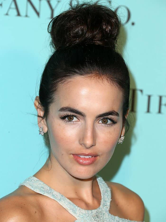 Camilla Belle's dark tresses were pulled up into a high bun