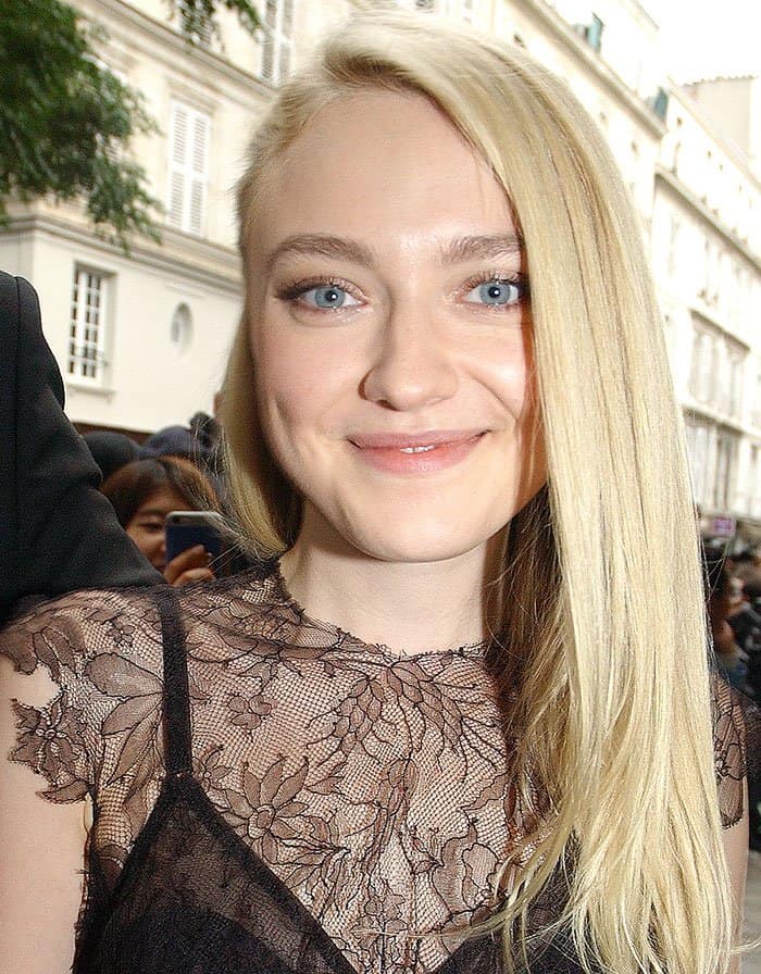 Dakota Fanning pinned her straightened tresses to one side 