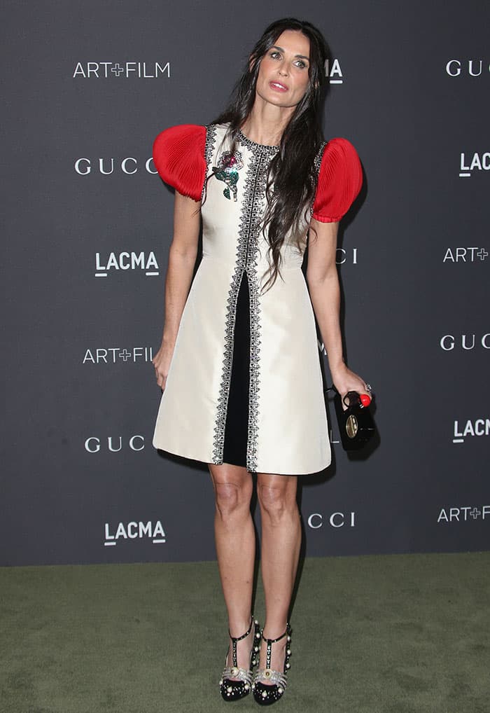 Demi Moore flaunts her legs in a Gucci silk shantung cocktail dress