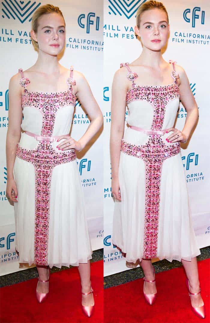 Elle Fanning wore a stunning Prada dress adorned with pink beads and bows, complementing her Elle Woods-inspired look with pink Mary Jane pumps and accessorizing with exquisite pink Tiffany & Co. jewelry