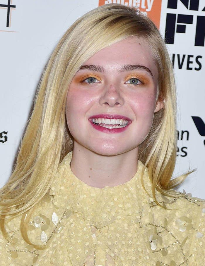 Always one to embrace vibrant beauty trends, Elle Fanning emphasized her eyes with a bold orange-tinted smoky eyeshadow