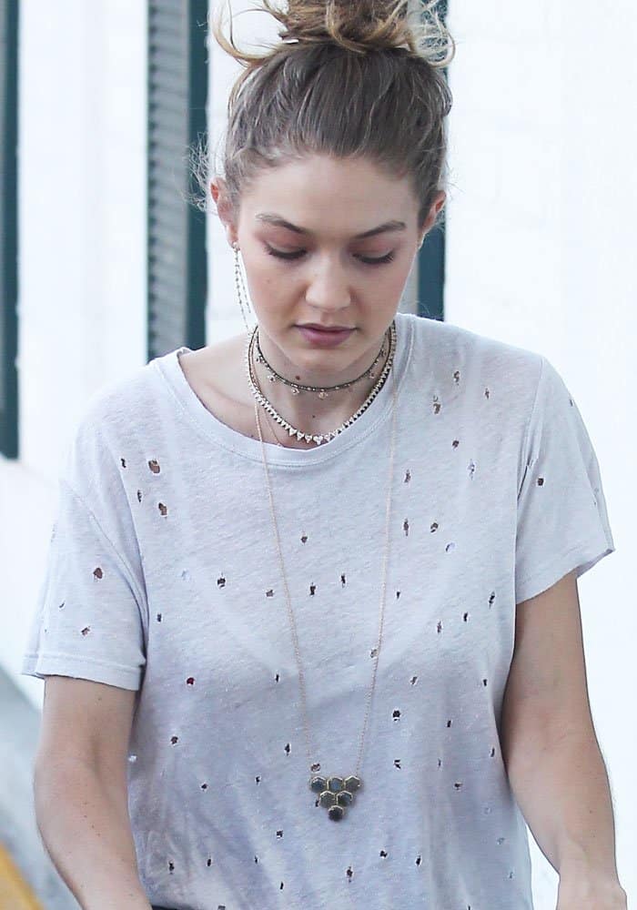 On October 22, 2016, Gigi Hadid was spotted at Bristol Farms in Los Angeles, elegantly wearing Jacquie Aiche jewelry while doing her grocery shopping