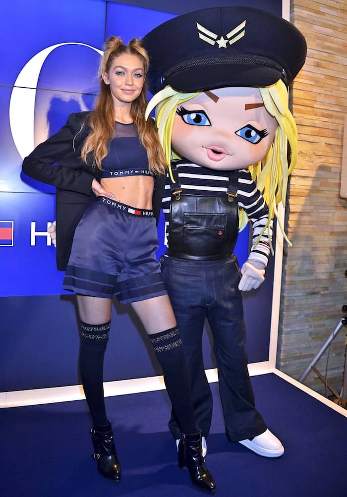 While Gigi Hadid's ensemble may not have been overtly schoolgirl-esque, it was her pairing of thigh-high socks with heeled boots that evoked the look