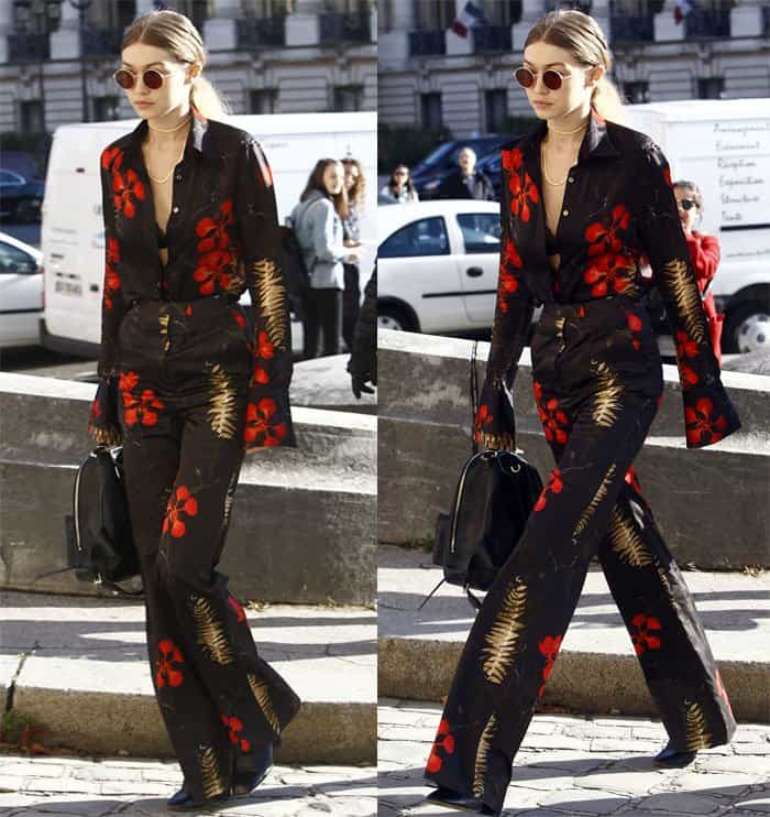 Gigi Hadid stuns in a black floral-print blazer and matching pants at Paris Fashion Week 2016