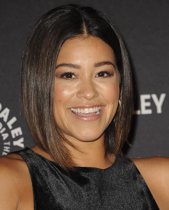 Gina Rodriguez in a black Vivian Chan velvet dress