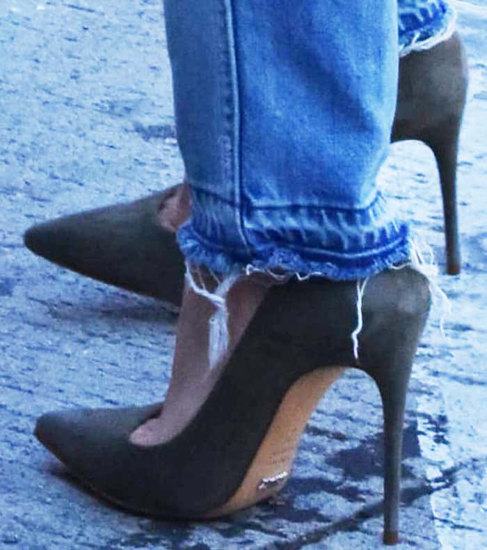 Hilary Duff effortlessly elevates her casual denim look with moss green Schutz "Gilberta" pumps, proving that heels can make any outfit stand out