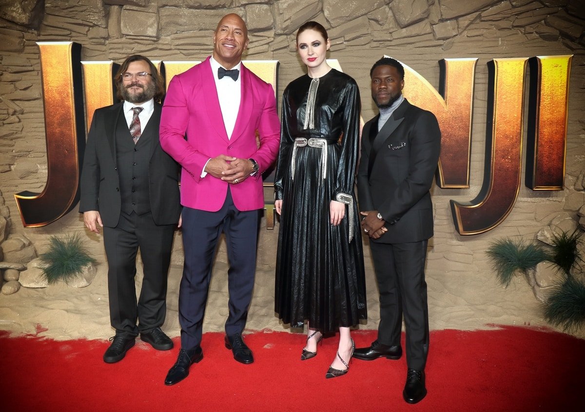 Short actors Jack Black and Kevin Hartand posing with their tall Jumanji co-stars Dwayne Johnson and Karen Gillan