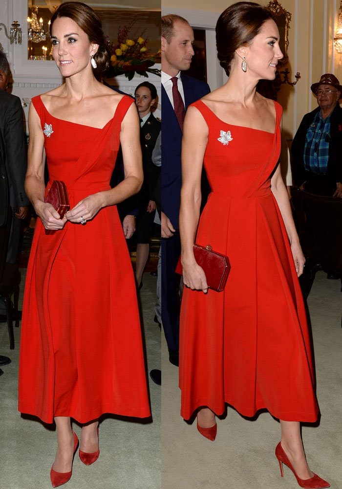 Kate Middleton exudes elegance in a striking red Preen by Thornton Bregazzi dress, perfectly accessorized with a matching clutch, Gianvito Rossi pumps, and Queen Elizabeth’s maple leaf brooch during her Canadian tour