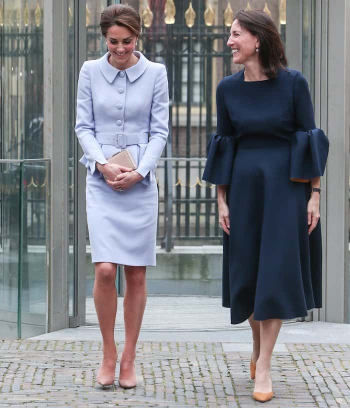 Kate Middleton in a powder blue Catherine Walker suit paired with Gianvito Rossi suede pumps for her first out of town trip alone to Holland on October 12, 2016