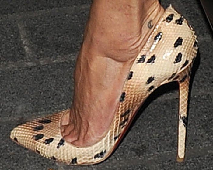 Kate Moss shows off her feet in Christian Louboutin "So Kate" pumps in spotted python print