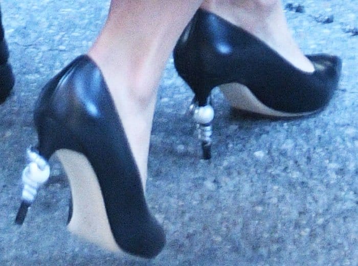 Katie Holmes wears a pair of Chanel pumps with the brand's trademark pearl heels