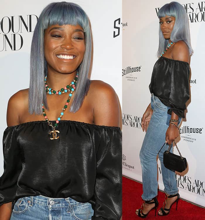 Keke Palmer's loose-fitting blouse boasted long sleeves and a subtle sheen finish, adding an element of sophistication to her ensemble at the What Goes Around Comes Around Beverly Hills opening event