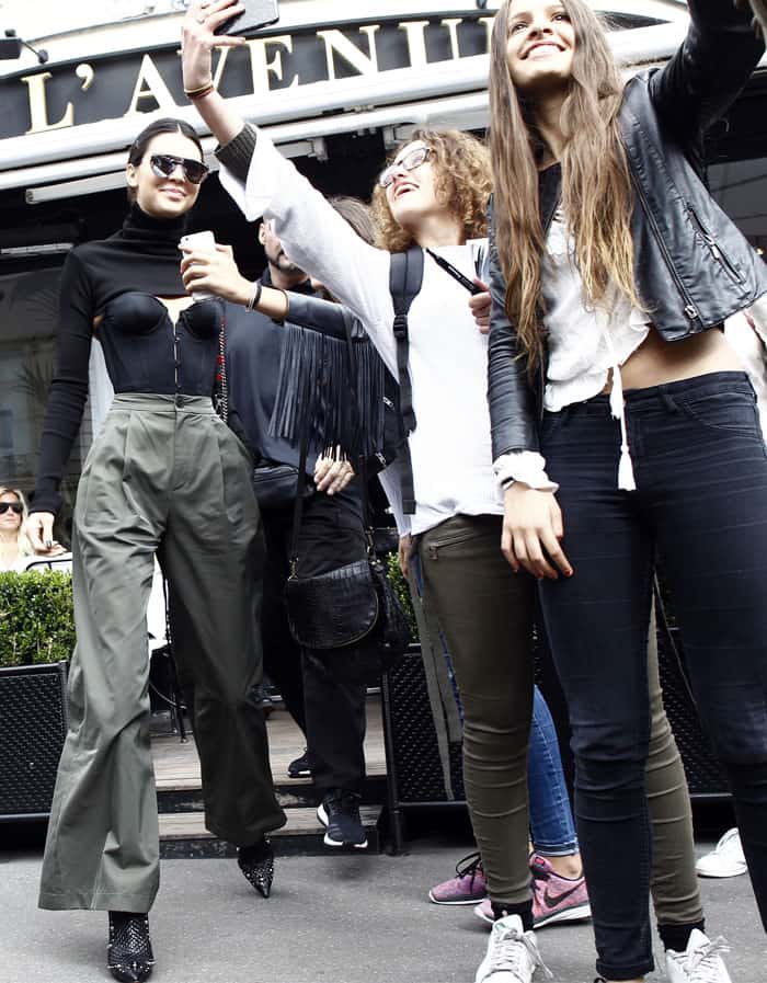 Kendall Jenner couldn't help but smile at the fans waiting outside her Paris hotel