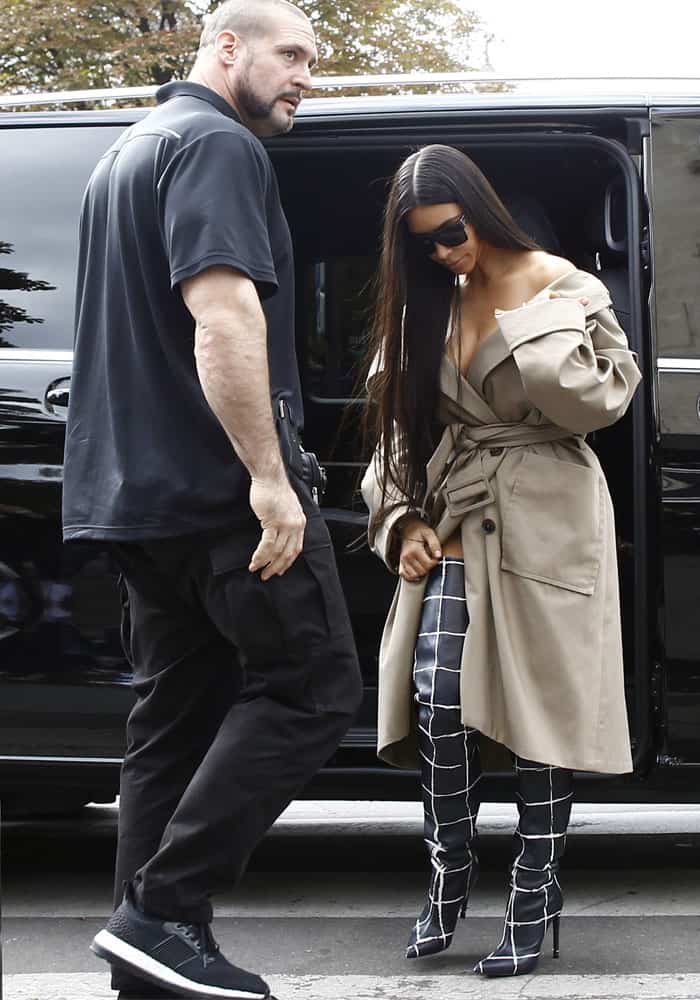 Kim Kardashian is captured in a photograph alongside her bodyguard, Pascal Duvier, who was absent during the robbery incident as he had accompanied her sisters, Kourtney and Kendall Jenner, to a nightclub