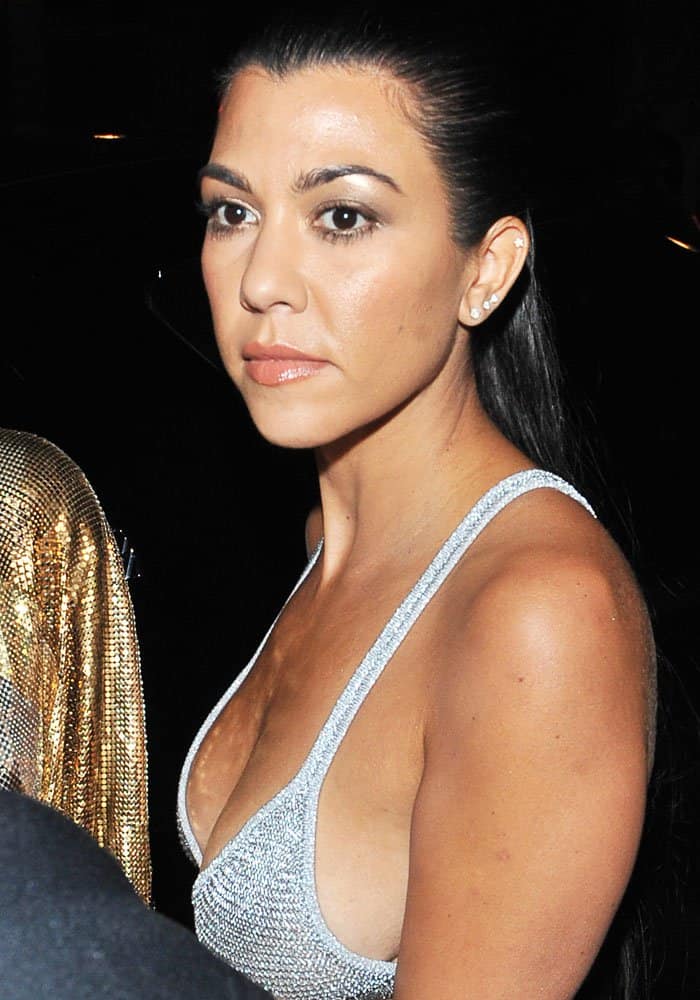 Kourtney Kardashian wearing a glittery bra top at the Paris Fashion Week Spring/Summer 2016 in France