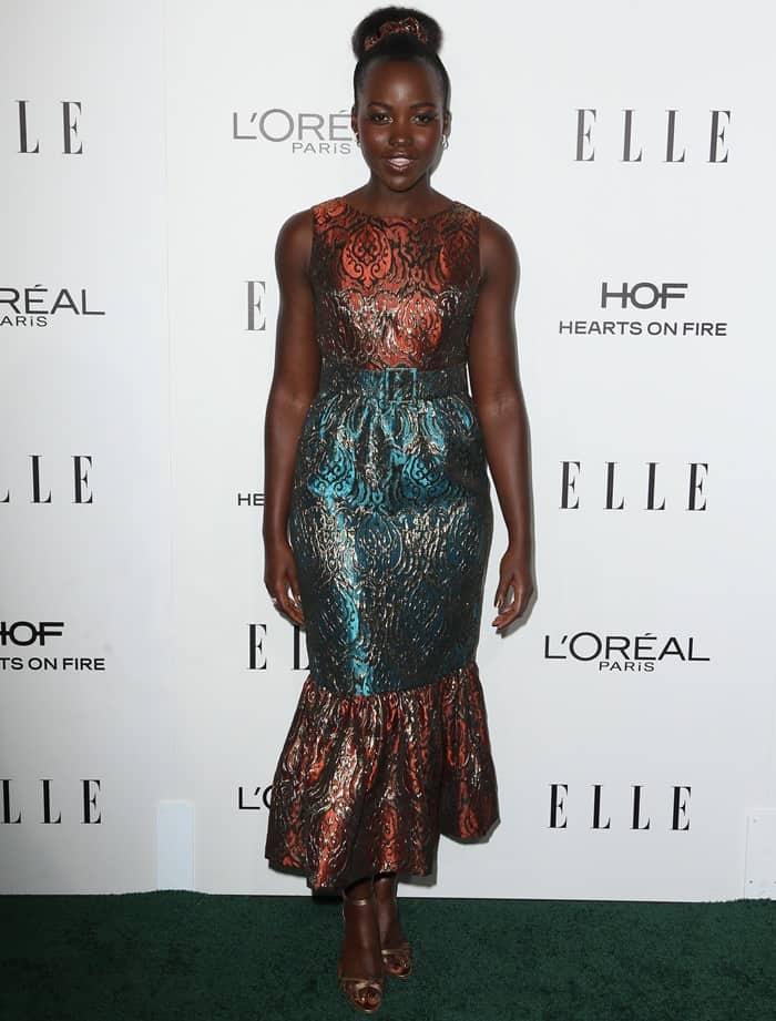 Lupita Nyong’o donned a belted Duro Olowu jacquard trumpet dress