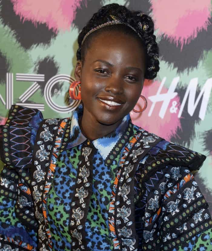 Lupita Nyong'o graced the occasion in a captivating, mismatched print dress