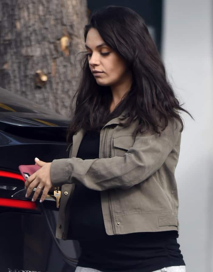 Even with minimal makeup and her hair down, Mila Kunis radiated beauty