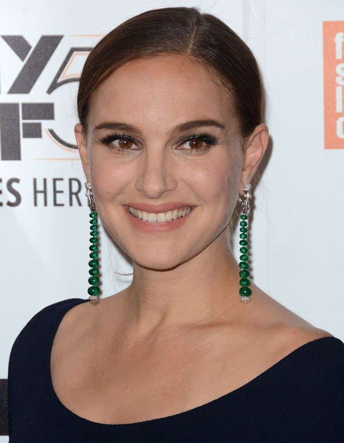 Natalie Portman's radiant smile and subtle makeup accentuating her warm brown eyes