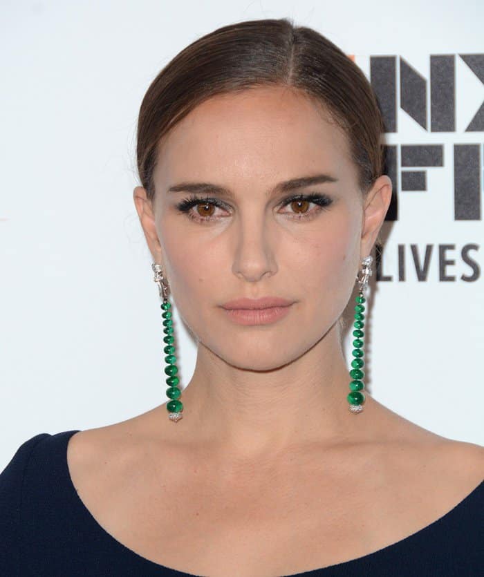 Natalie Portman complements her Dior dress with striking emerald drop earrings by Van Cleef & Arpels