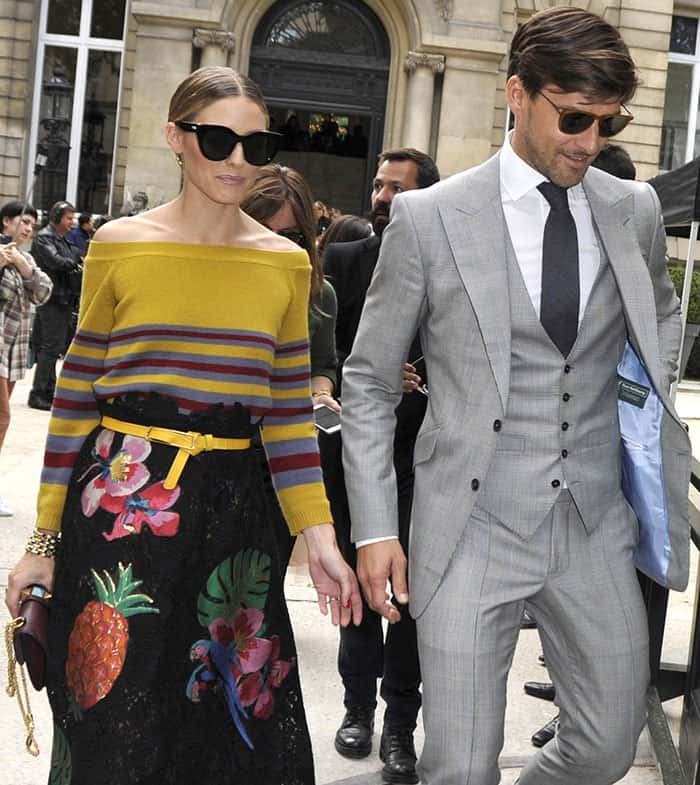 Accompanied by her husband, Johannes Huebl, Olivia Palermo made a striking entrance, donning a head-turning ensemble by the esteemed Italian fashion designer