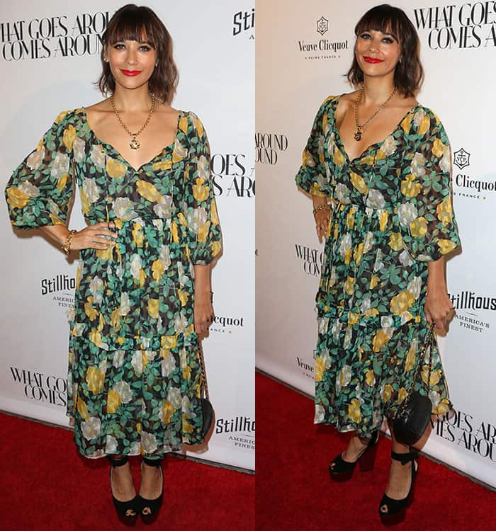 Rashida Jones's vintage Saint Laurent dress features three-quarter sleeves and a midi-length hemline that balances out the cleavage-baring neckline