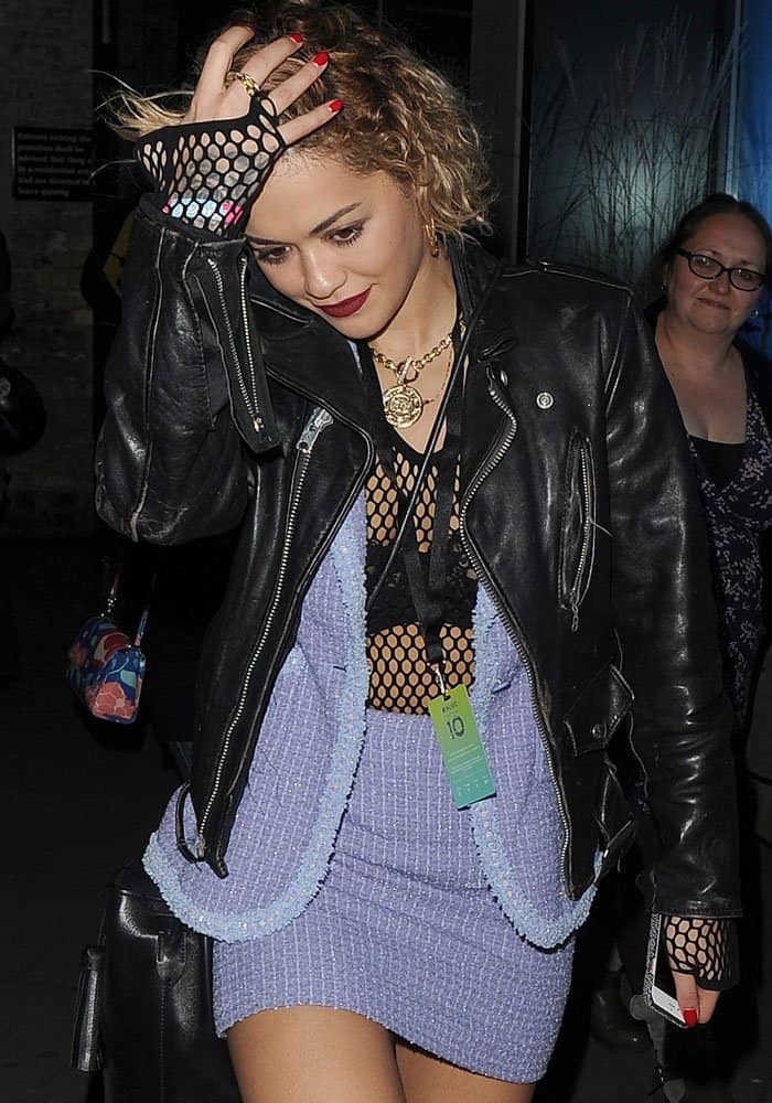 Rita Ora throws a leather jacket on her Madonna-inspired look as the evening gets chilly