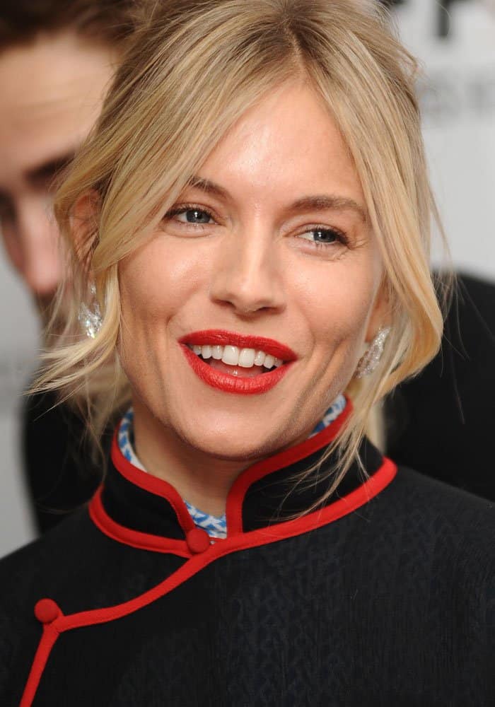 Sienna Miller's outfit combines elements of Chinese design with modern twists