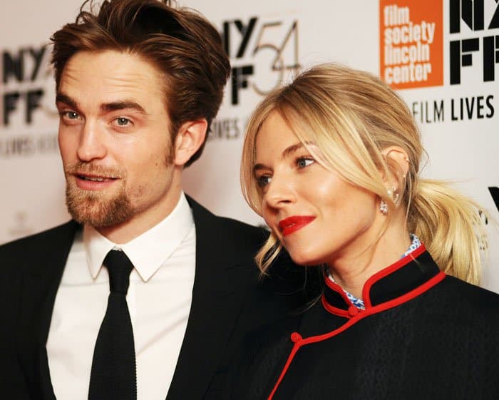 Sienna Miller poses with her "The Lost City of Z" co-star Robert Pattinson