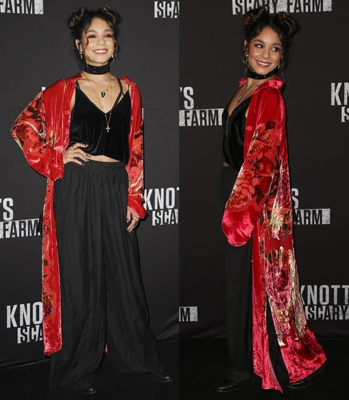 Vanessa Hudgens channels gothic glamour in a red velvet kimono and black ensemble at Knott's Scary Farm