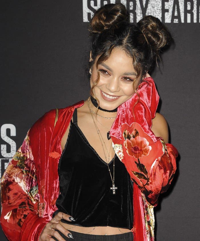 Vanessa Hudgens rocks double buns and layered jewelry, embracing her '90s-inspired gothic look