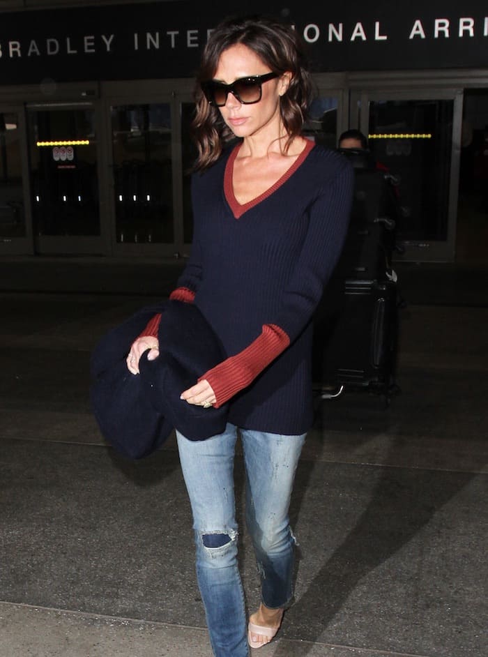 Victoria Beckham rocked a sweater from her own line and paired it with distressed jeans