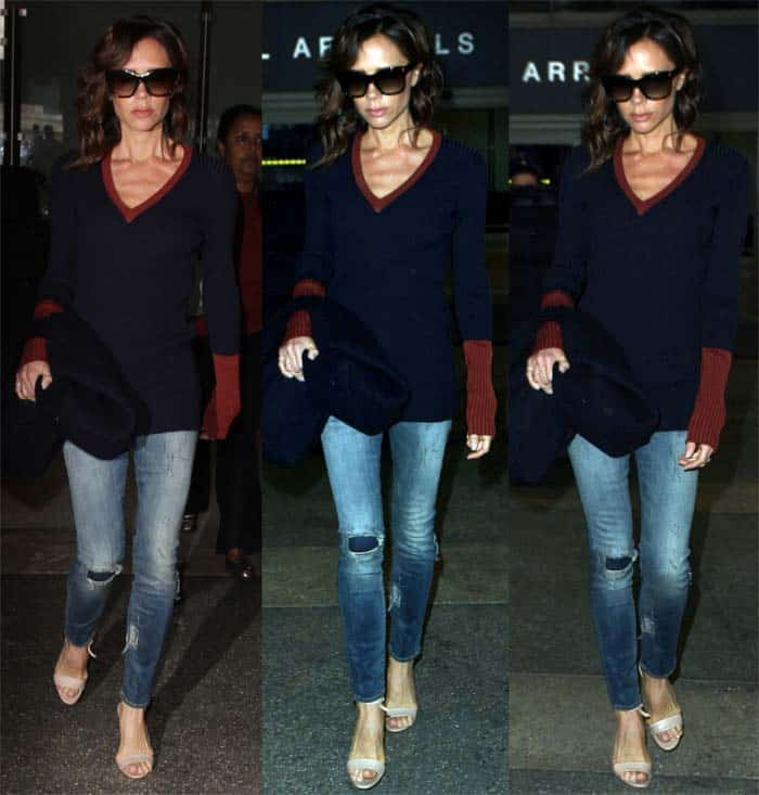 Victoria Beckham struts in Manolo Blahnik "Tres" sandals as she arrives at Los Angeles International Airport