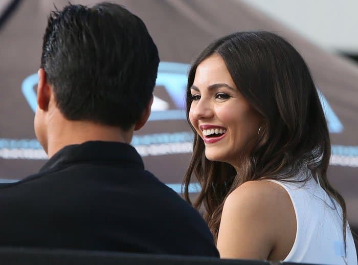 Victoria Justice visits Universal Studios in Los Angeles for an interview with Mario Lopez and Charissa Thompson for the television show "Extra TV"