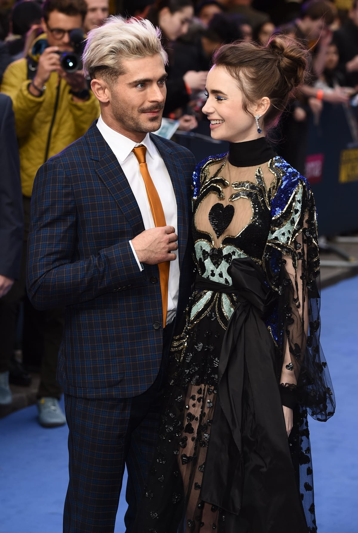 Zac Efron is 4 inches taller than Lily Collins, with a height of 5ft 8 (172.7 cm) compared to Lily's 5ft 4 (162.6 cm)