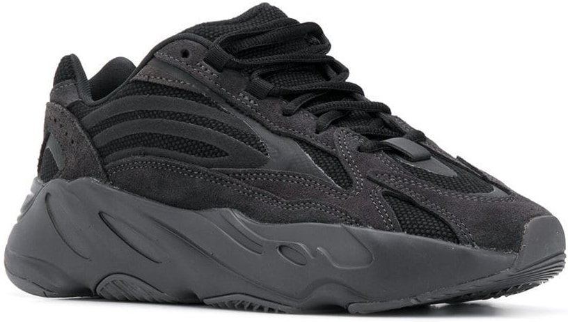 Kim Kardashian wore black adidas YEEZY Yeezy Boost 700 V2 "Vanta" sneakers featuring a mesh base with all overlays in suede, as well as detailing in a reflective film for a touch of flash