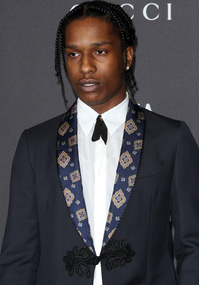 A$AP Rocky exudes effortless style in a navy suit with an intricately patterned lapel and a sleek black bow tie at the 2016 LACMA Art + Film Gala