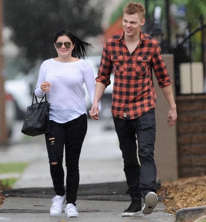 Ariel Winter steps out in a laid-back look, pairing a white long-sleeved tee with distressed black jeans and Adidas "Superstar" sneakers