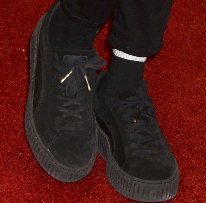 Cara Delevingne paired her H&M ensemble with the Puma x Rihanna "Creeper" sneakers in black