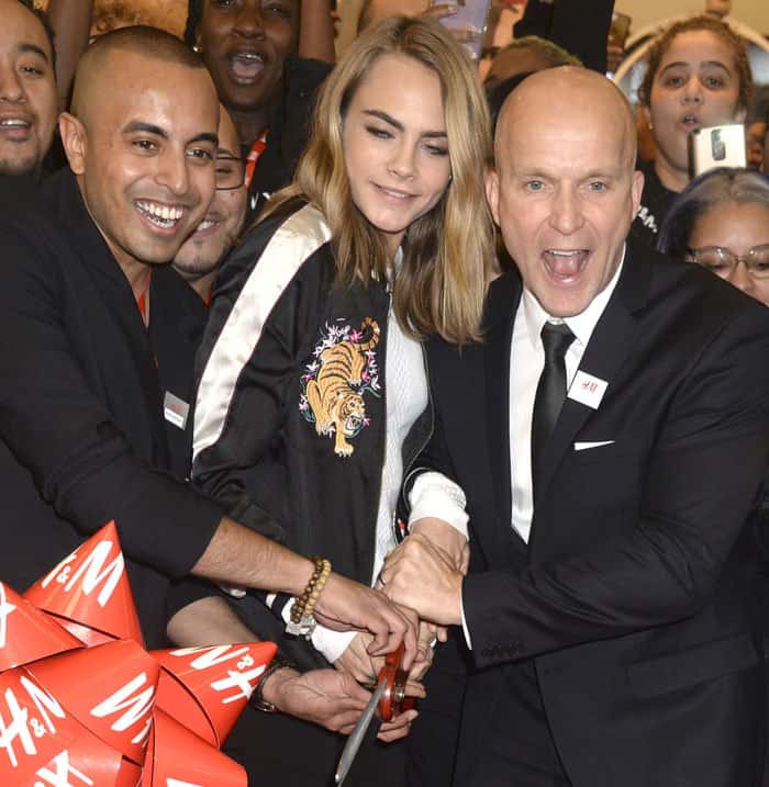 Cara Delevingne assisting with the Westfield H&M ribbon cutting