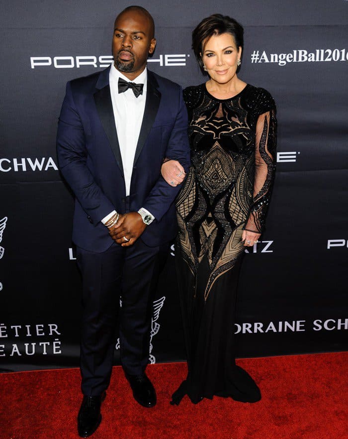 Kris Jenner and Corey Gamble pose on the red carpet at the 2016 Angel Ball, with Kris dazzling in a black velvet Zuhair Murad gown