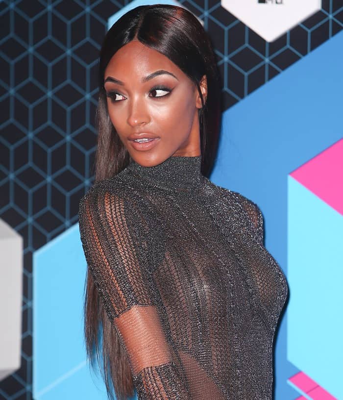 On the red carpet, Jourdan Dunn donned a custom-made Balmain sheer black long-sleeve knit floor-length turtleneck dress