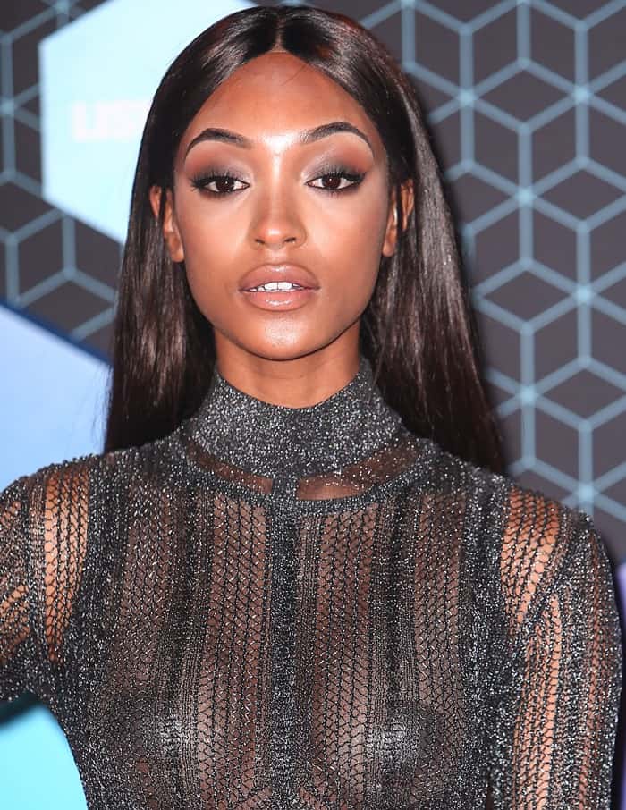 Jourdan Dunn opted not to wear a bra in a revealing see-through dress adorned with cut-out panels