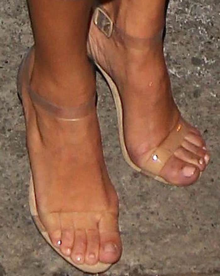 Kourtney Kardashian shows off her naked feet in Yeezy Lucite sandals
