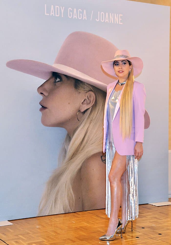 Lady Gaga flaunts her sexy legs in a silver dress featuring fringe detailing