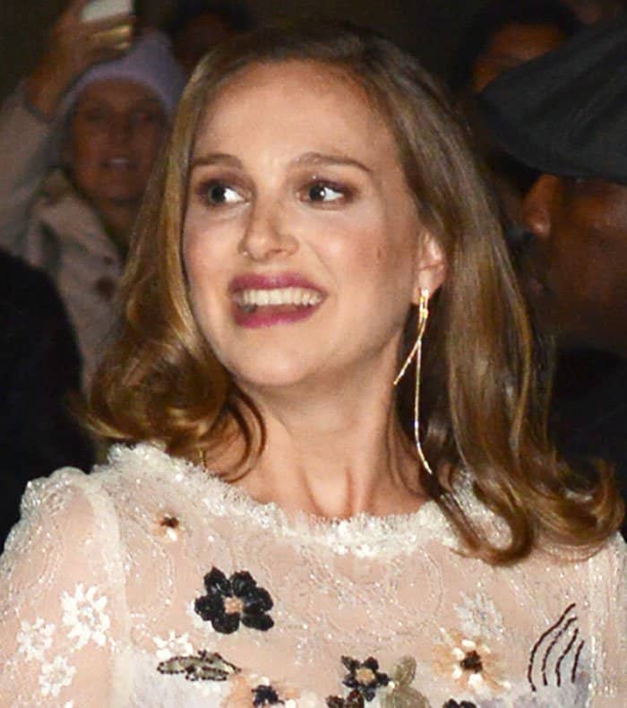 Natalie Portman radiates warmth with her genuine smile, her eyes sparkling as she embraces the moment