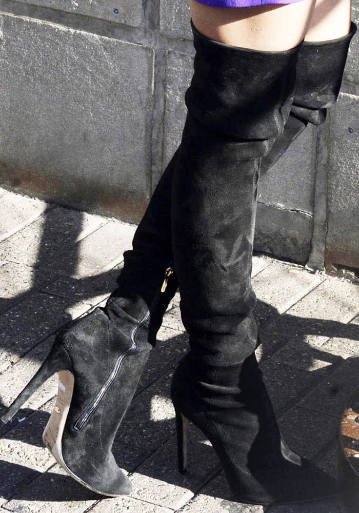 Priyanka Chopra warms up her legs in a pair of Jimmy Choo "Toni" boots